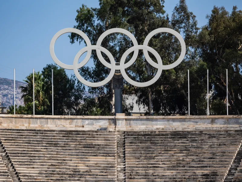 The Olympic rings above the marble seating of the Panathenaic Stadium.
